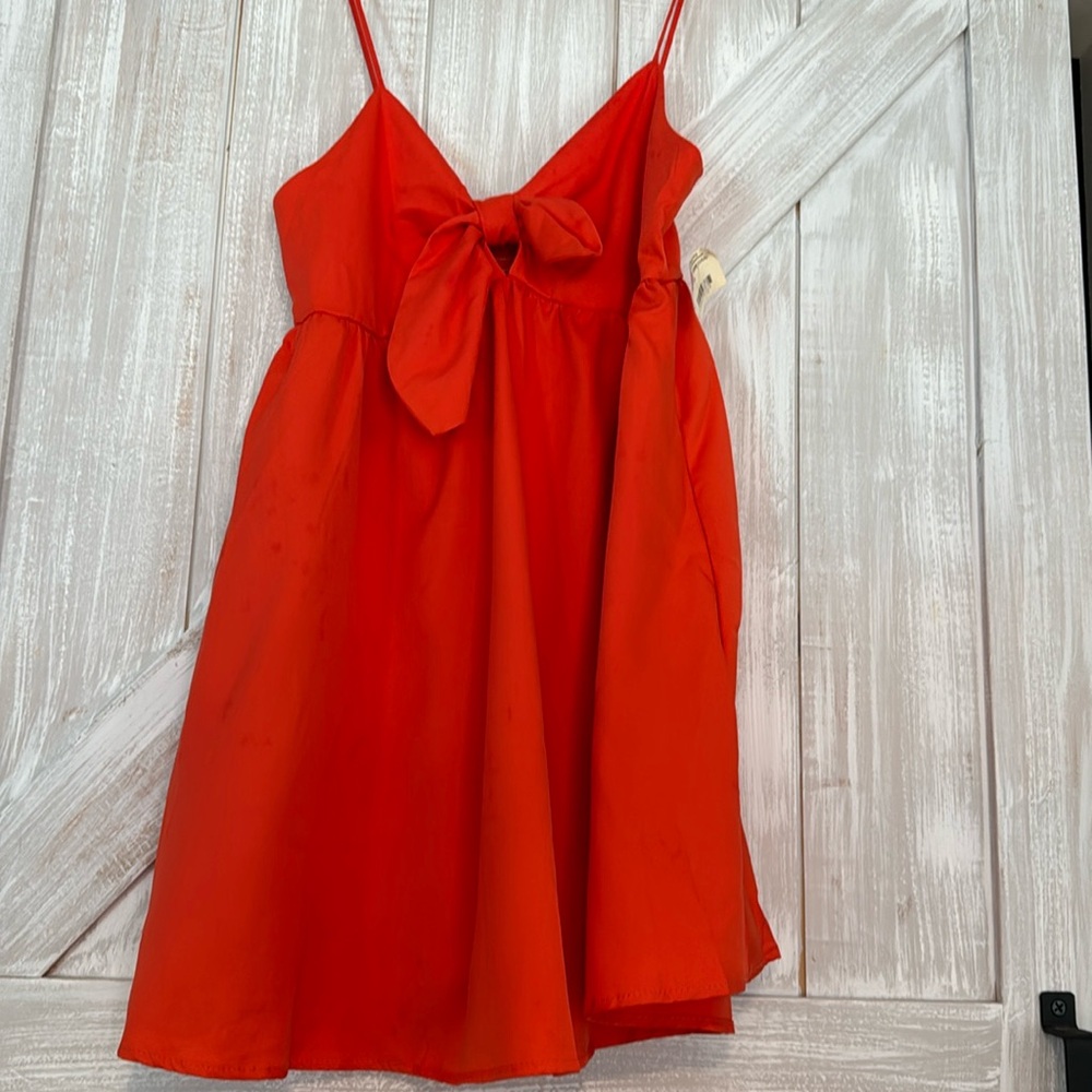 The Impeccable Pig darling orange sleeveless short dress with adjustable straps.